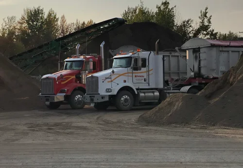 A. Préfontaine & Associés dump trucks at the bulk-materials yard, loaded for delivery